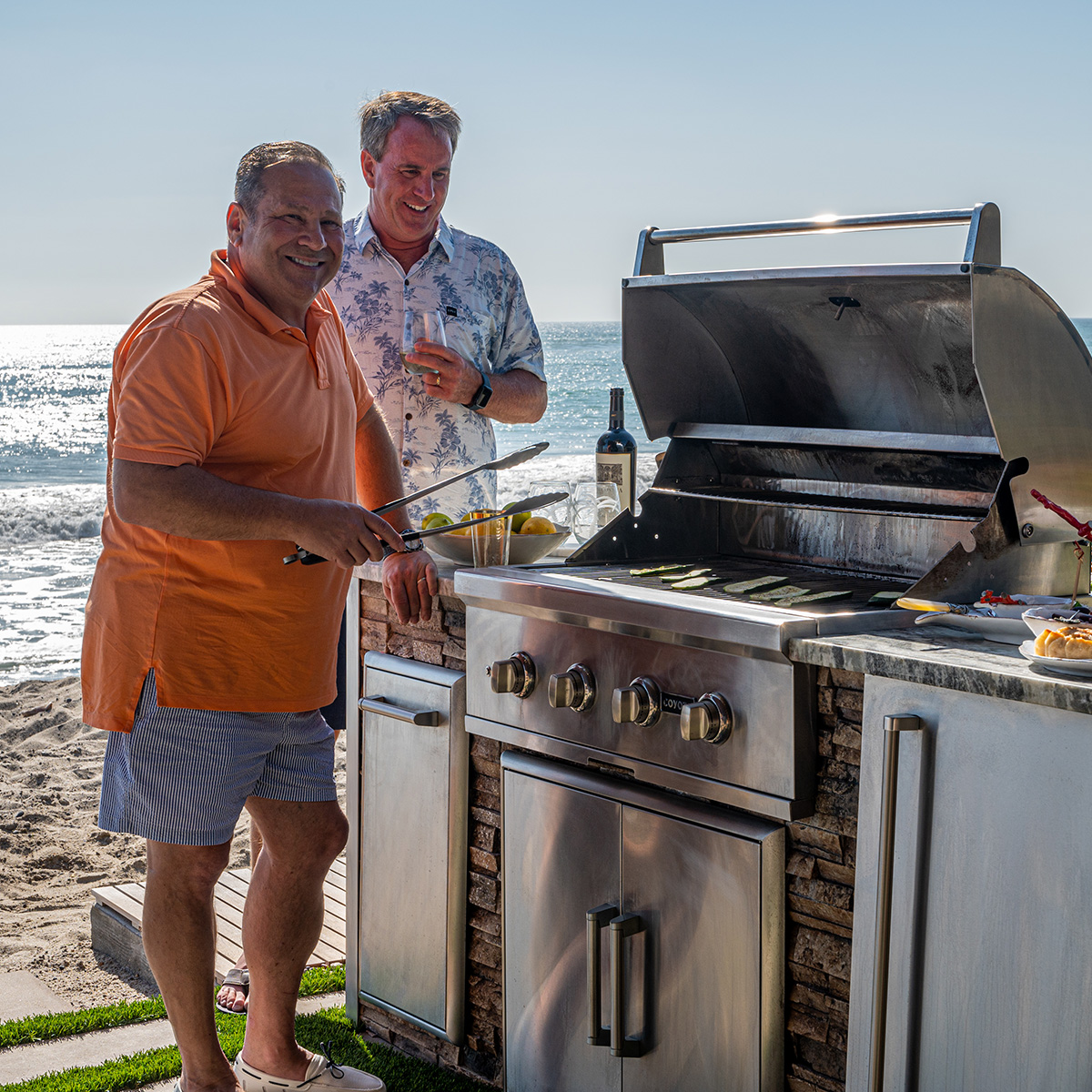 Customer enjoying their finished outdoor kitchen